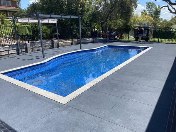 Pool surround after the decorative coating by Exterior Corp